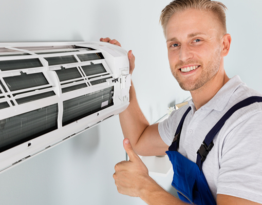 A man is repairing air conditioner