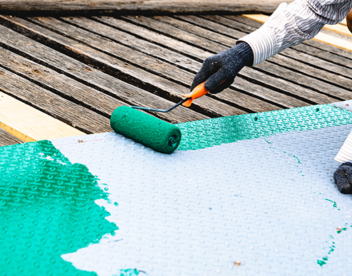 painting roller and a man paints