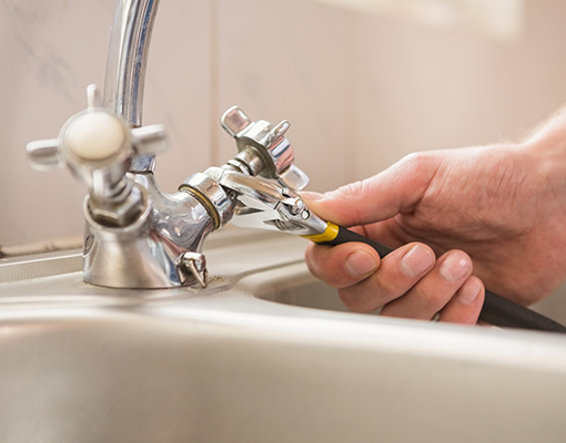 plumber is doing pipe repairing